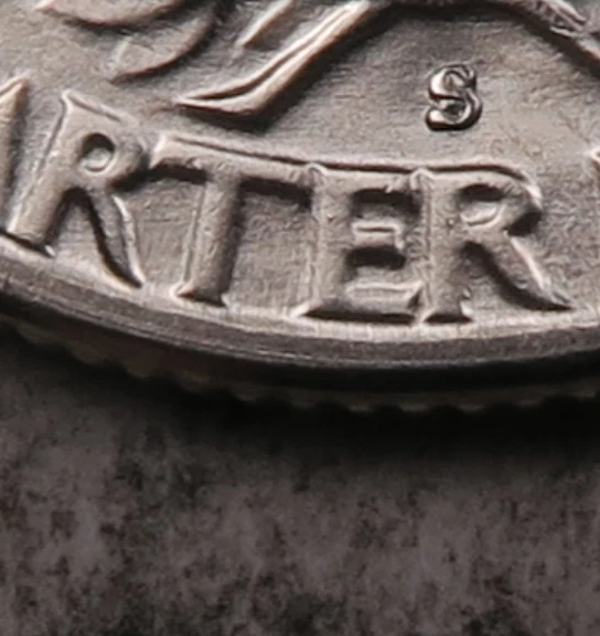 1954-S quarter RPM-001 repunched mint mark showing secondary S displaced to the north above the primary S under magnification
